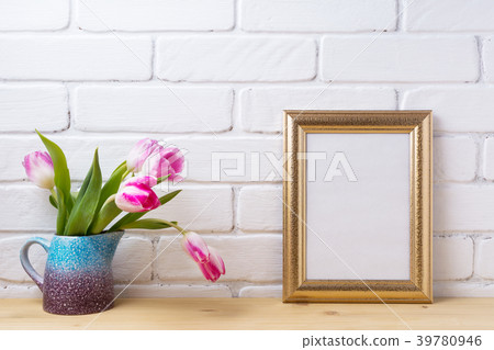 Gold decorate frame mockup with magenta pink tulip 39780946