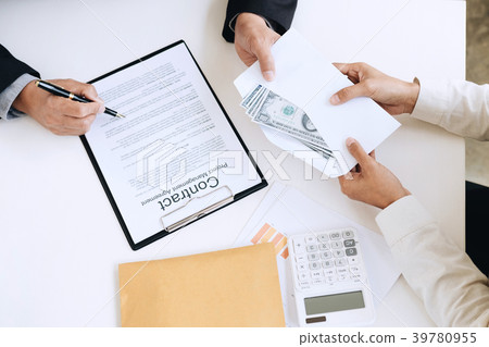 Bribery and corruption concept, bribe in the form of dollar bill Bribery and corruption concept, bribe in the form of dollar bill 39780955