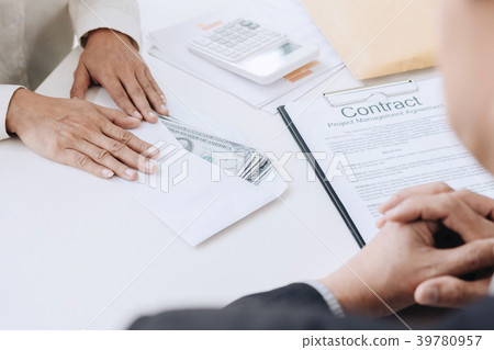 Bribery and corruption concept, bribe in the form of dollar bill 39780957