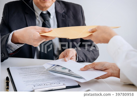Bribery and corruption concept, bribe in the form of dollar bill 39780958