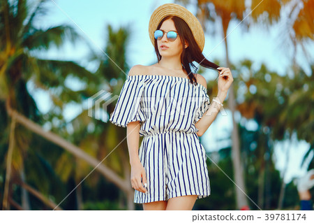 beautiful girl walking along the beach beautiful girl walking along the beach 39781174