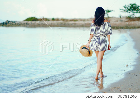 beautiful girl walking along the beach beautiful girl walking along the beach 39781200