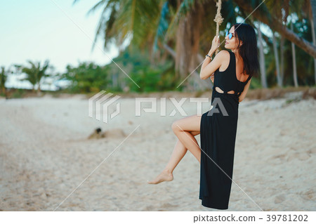 girl swinging on a swing 39781202