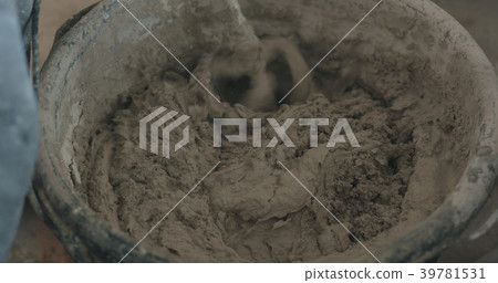 mixing concrete plaster with electric mixer mixing concrete plaster with electric mixer 39781531