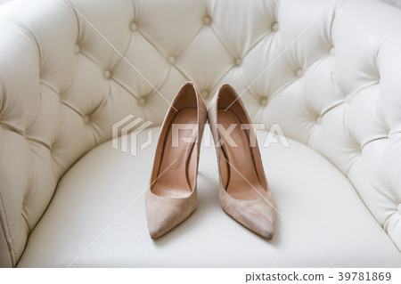 luxury shoes with heels of suede on the couch luxury shoes with heels of suede on the couch 39781869