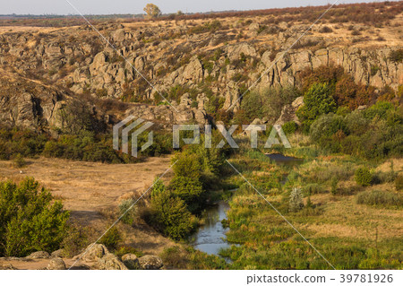 Rock canyon against beautiful sunset background Rock canyon against beautiful sunset background 39781926