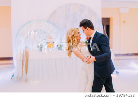 Happy young bride and groom dance in the wedding Happy young bride and groom dance in the wedding 39784158