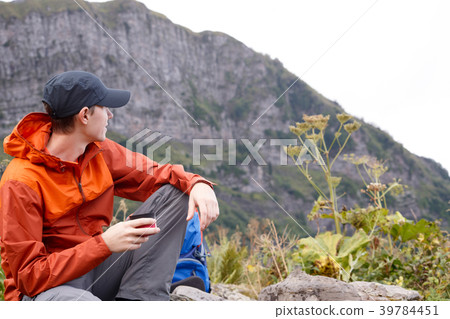 Picture of brunette in cap with glass against of 39784451