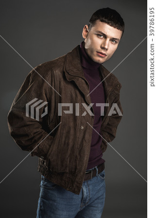 Focused male looking at camera Focused male looking at camera 39786195