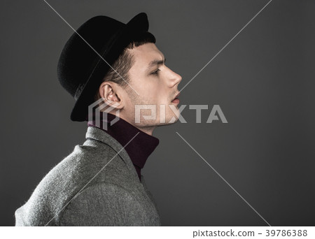 Thoughtful stylish male looking directly 39786388