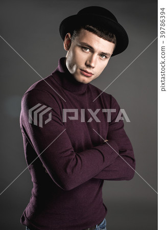 Pensive male watching at camera 39786394