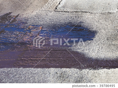 spot of bitumen on the asphalt surfacque 39786495