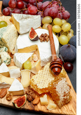 Camembert cheese with honey, figs, walnuts on Camembert cheese with honey, figs, walnuts on 39786806