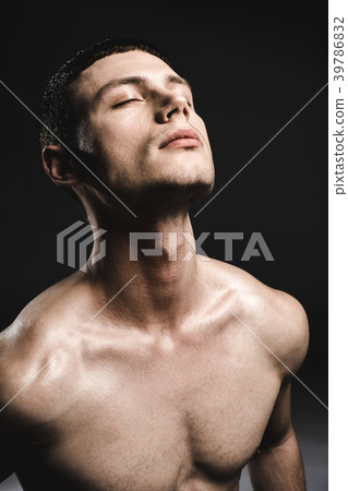 Orderly handsome male stripped to waist 39786832