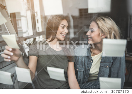 Happy coworkers identifying strengths and Happy coworkers identifying strengths and 39787170