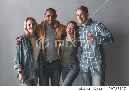Enjoyed students standing in embrace Enjoyed students standing in embrace 39788127
