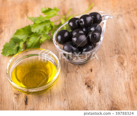 Olives and Healthy Olive oil  cup with parsley 39788324
