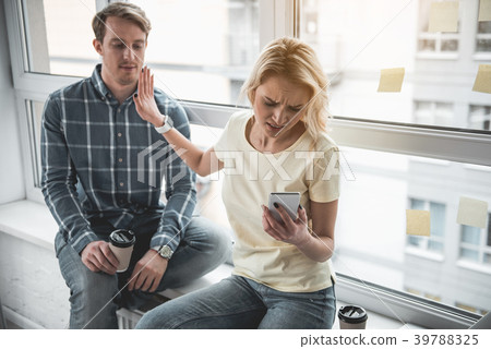 Irritated lady not allowing friend talking to her Irritated lady not allowing friend talking to her 39788325