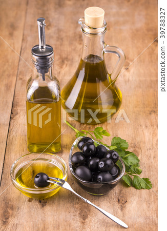 Olives and Healthy Olive oil bottles and cup Olives and Healthy Olive oil bottles and cup 39788327
