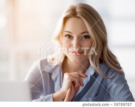Pretty blond woman enjoying her work 39789787