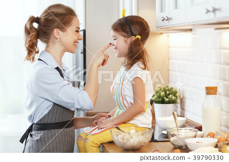 happy family in kitchen. mother and child baking cookies  . 39790330