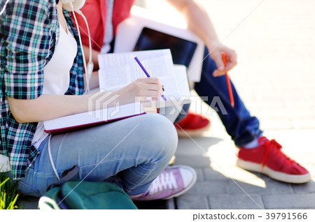 young happy students with books and notes young happy students with books and notes 39791566