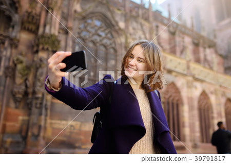 tourist making selfie mobile photo 39791817