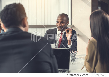 Happy employer talking with colleagues Happy employer talking with colleagues 39791825
