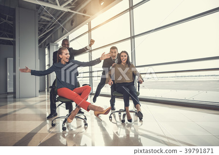 Happy partners riding on chairs 39791871