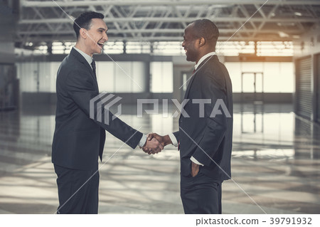 Smiling businessmen locating in warehouse Smiling businessmen locating in warehouse 39791932