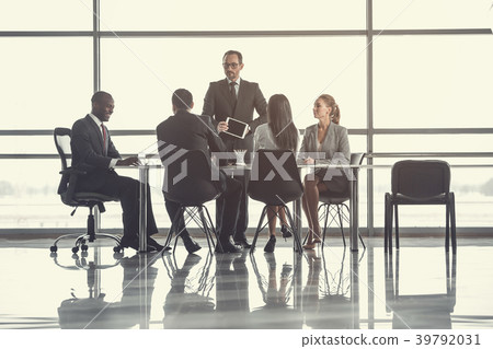 Focused man showing appliance for partners 39792031