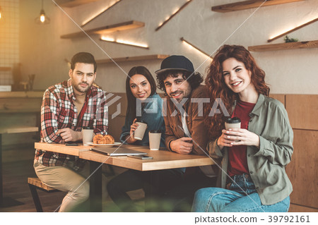 Cheerful young people having fun in cafeteria 39792161