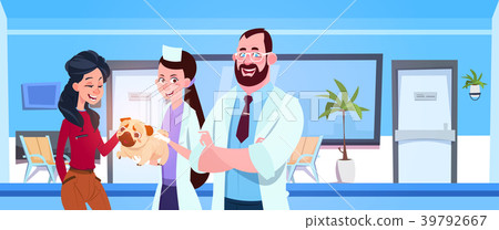 Vet Doctors Giving Healthy Dog To Happy Owner In 39792667