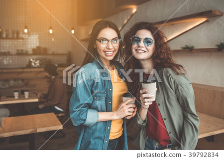 Carefree women relaxing in cafeteria 39792834