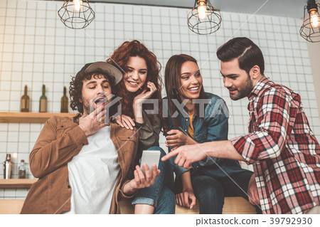 Excited young men and women entertaining with Excited young men and women entertaining with 39792930