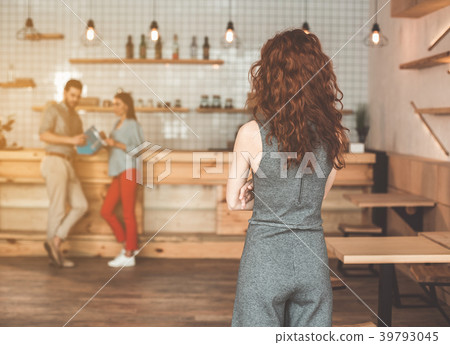 Lady watching her man flirting with girl in 39793045