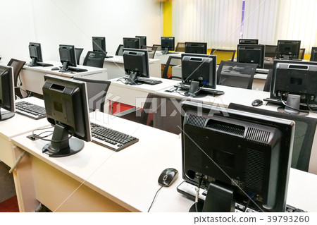 Empty computer classroom with computer monitors Empty computer classroom with computer monitors 39793260