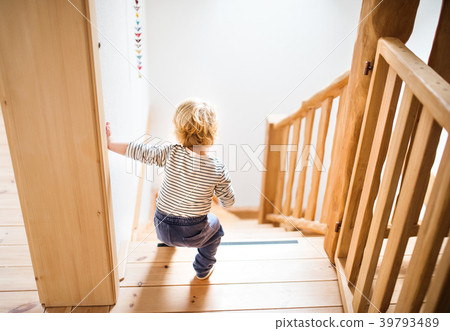 Toddler boy in dangerous situation at home. Child Toddler boy in dangerous situation at home. Child 39793489