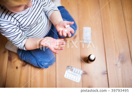 Toddler boy in a dangerous situation at home. Toddler boy in a dangerous situation at home. 39793495