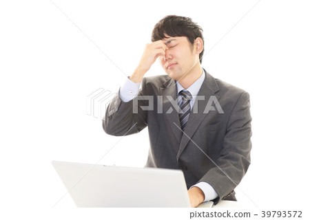 A tired businessman A tired businessman 39793572