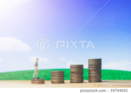 Miniature figures businessman walking on money 39794002