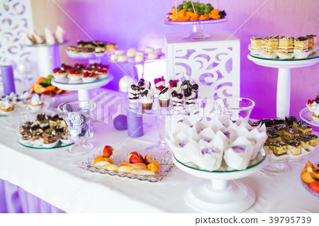 Delicious sweets on wedding candy buffet with Delicious sweets on wedding candy buffet with 39795739