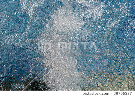 Air bubbles and rippled water in swimming pool 39796587