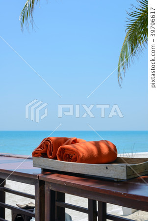 orange towels in wooden box near beach orange towels in wooden box near beach 39796617