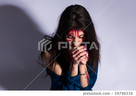 Rape battered bloody victim sad woman sits on the 39798338