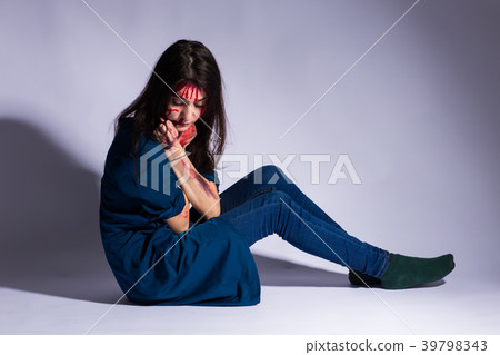 Rape battered bloody victim sad woman sits on the 39798343
