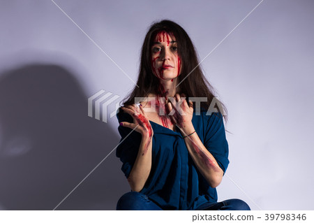 Rape battered bloody victim sad woman sits on the 39798346