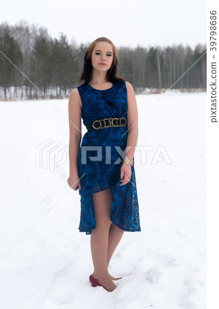Beautiful girl in winter forest 39798686