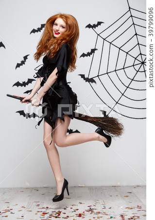 Halloween Concept - Happy elegant witch enjoy Halloween Concept - Happy elegant witch enjoy 39799096