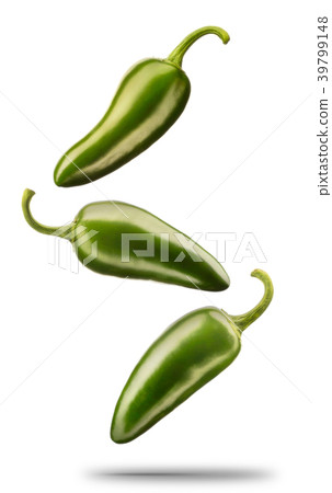 Falling green chilli pepper isolated on white Falling green chilli pepper isolated on white 39799148
